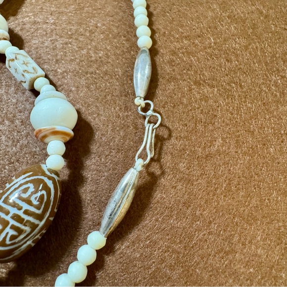White and Brown Beaded Necklace with Decorative Elements - Picture 2 of 4